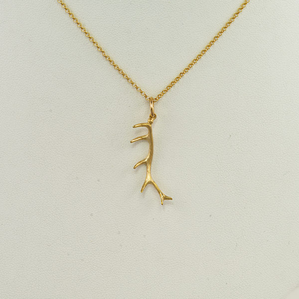 Large antler pendant in 14kt yellow gold.