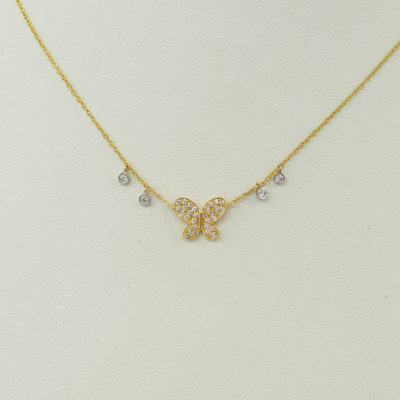 Butterfly pendant in 14kt yellow gold with diamond accents. The gold is 14kt and the diamonds are round, brilliant cut.