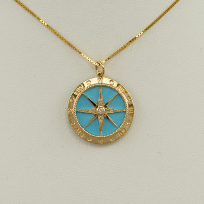 This Turquoise compass pendant has been set in 14kt yellow gold. The turquoise is from the Sleeping Beauty mine. The chain is not included.