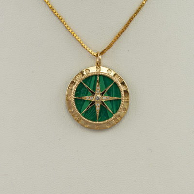 This Turquoise compass pendant has been set in 14kt yellow gold. The turquoise is from the Sleeping Beauty mine. The chain is not included.
