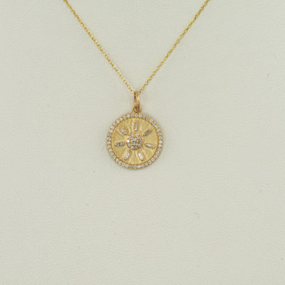 This diamond compass pendant was set in 14kt yellow gold. The chain is not included. We also offer other compass pendants.