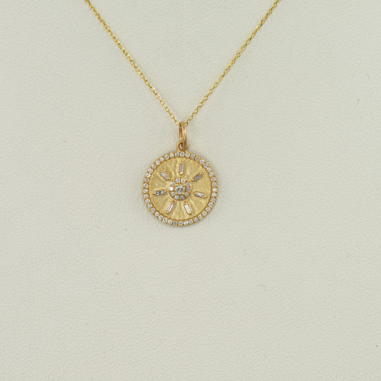 This diamond compass pendant was set in 14kt yellow gold. The chain is not included. We also offer other compass pendants.