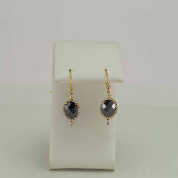 This hematite earrings have been made with 4kt yellow gold. Accenting the hematite are white diamonds. Ask about our other black earrings.