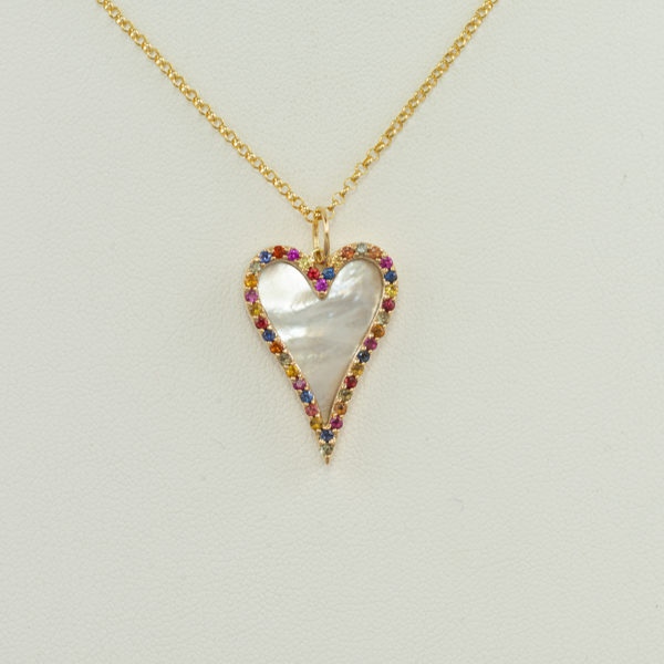 Here is a mother of pearl pendant. It has multi colored sapphire accents. Both the sapphires and the mother of pearl have been set in 14kt yellow gold. The chain is not included in the price.