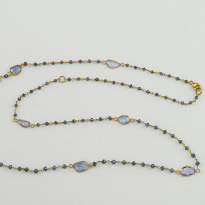 This is a Sapphire and Diamond Necklace. It has been made with 14kt yellow gold. The diamonds in this piece are blue in color. It can be worn at 18" or 20". 