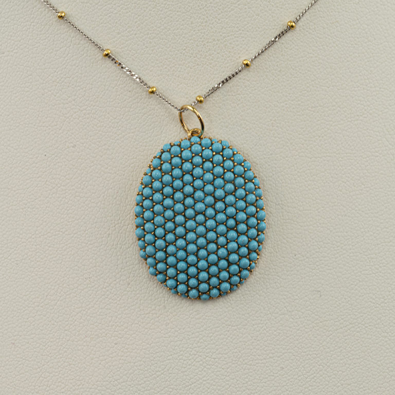 This sleeping beauty turquoise pendant was made with 14kt yellow gold. The chain is not included in the price.
