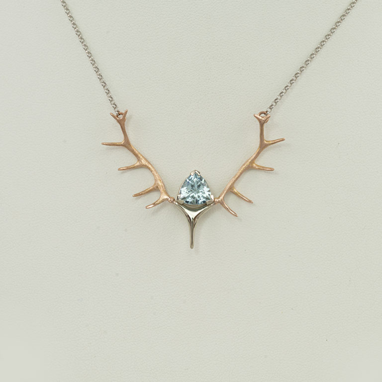 This aquamarine antler necklace is a one-of-a-kind. Our designer has used a combination of 14kt white and yellow gold. It has a lobster claw clasp.