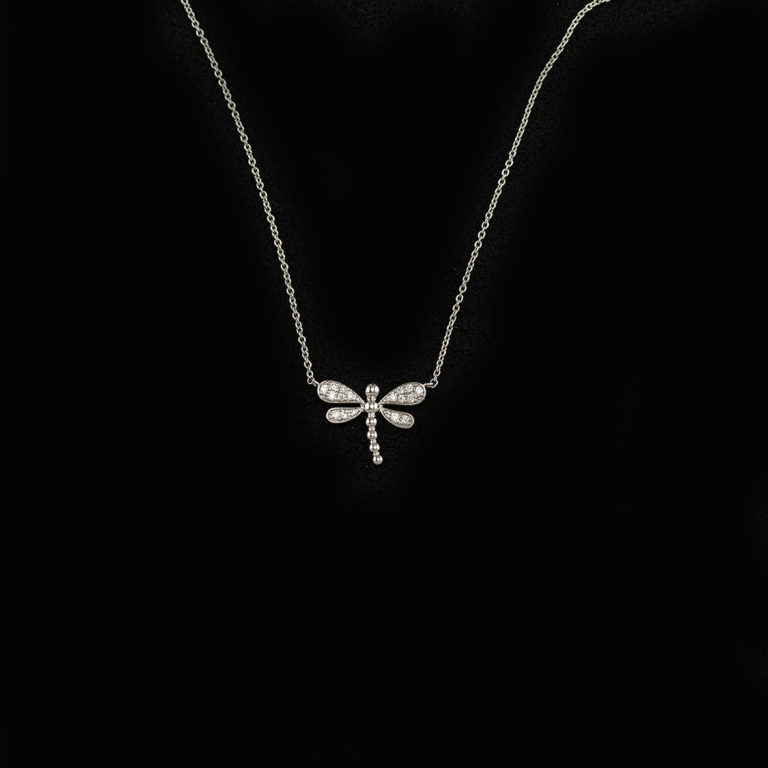 This diamond dragonfly necklace was made in 14kt white gold. The chain is included in the price. The chain is 18" is length, but can also be worn at 16".