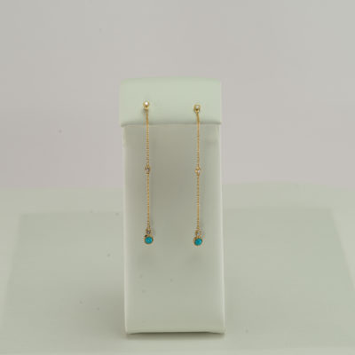 This pair of turquoise earrings was made with 14kt gold and diamond accents. We have a variety of necklaces to match.