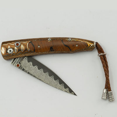 This knife is the Taos. It is 75 of 250 produced. Featuring wave damascus, mokume gane, citrine and spalted beechwood.