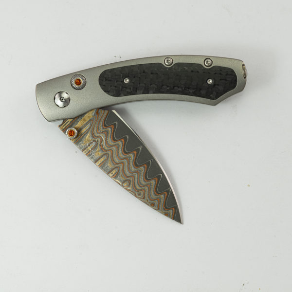 This is the fervor by William Henry.  Number 149 of 250 produced. The fervor features titanium, carbon fiber, citrine and a copper wave blade. The blade is B09.