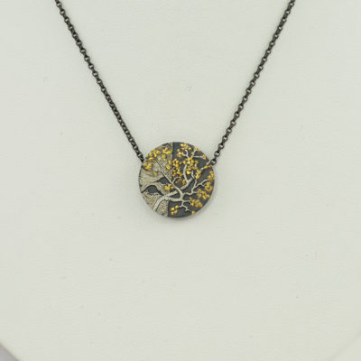 Here is an aspen pendant by Wolfgang Vaatz. It was made with sterling silver, argentium silver and 24kt raw gold.
