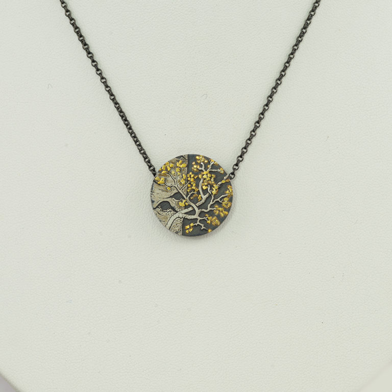 Here is an aspen pendant by Wolfgang Vaatz. It was made with sterling silver, argentium silver and 24kt raw gold.