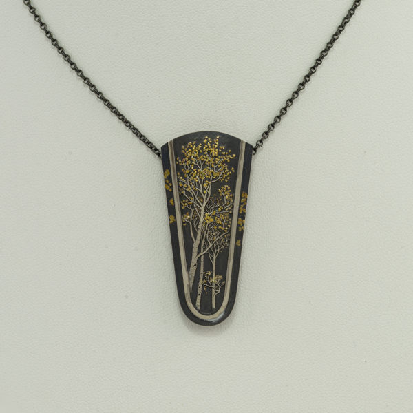 This aspen necklace has 24kt gold, argentium silver and sterling silver. The chain is adjustable and we do offer earrings to match.