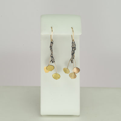 These aspen dangle earrings have been made with silver and gold. The silver is argentium and the gold is a mixture of 14 and 18kt.