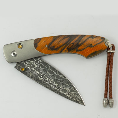 This is the forest grove by William Henry. This is 219 of 500 produced. It features intrepid damascus, titanium.