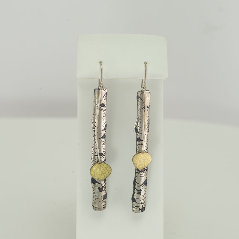 These are the long aspen earrings by Wolfgang Vaatz. They have been made with Argentium silver, sterling silver and 18kt yellow gold.