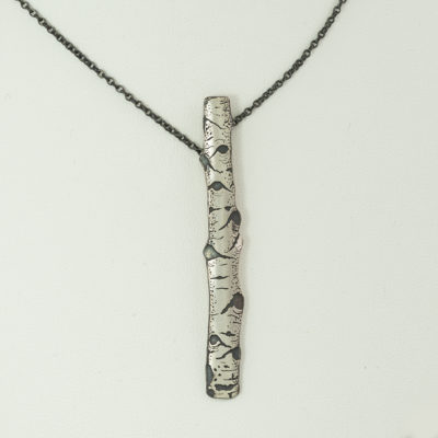 Here is the argentium aspen pendant by Wolfgang Vaatz. The chain is adjustable from 16-19 inches. The chain is oxidized sterling silver.