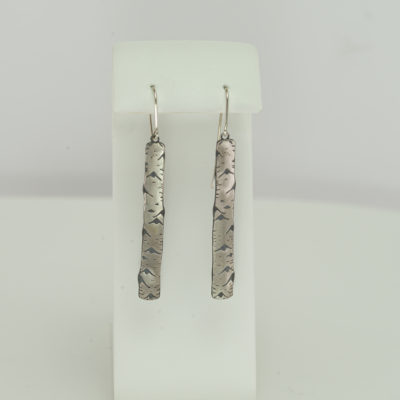 These are the aspen dangle earrings by Wolfgang Vaatz. The "aspens" are made with argentium silver ear wires are sterling silver.