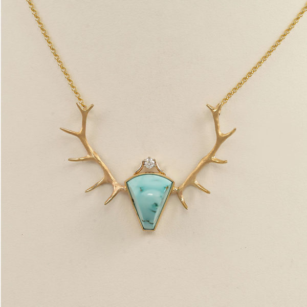 This is our Large Elk Antler Necklace featuring a Royston Turquoise center, with a diamond accent. Cast in 14kt yellow gold, with the bezel back cast in sterling silver.
