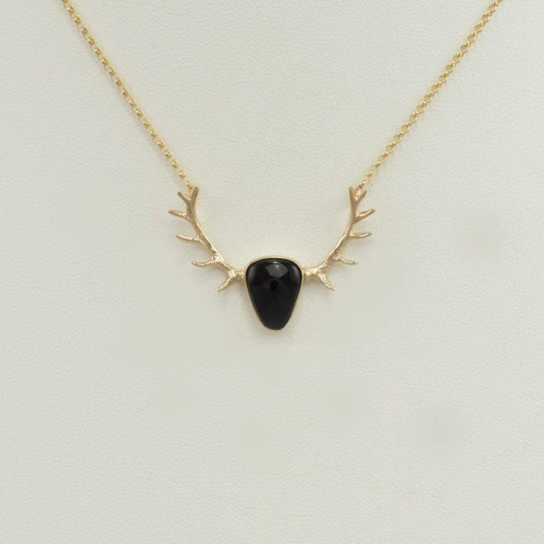 Wyoming Black Jade Elk Antler Pendant is in our small size. The antlers, chain and bezel are 14 KT yellow gold.