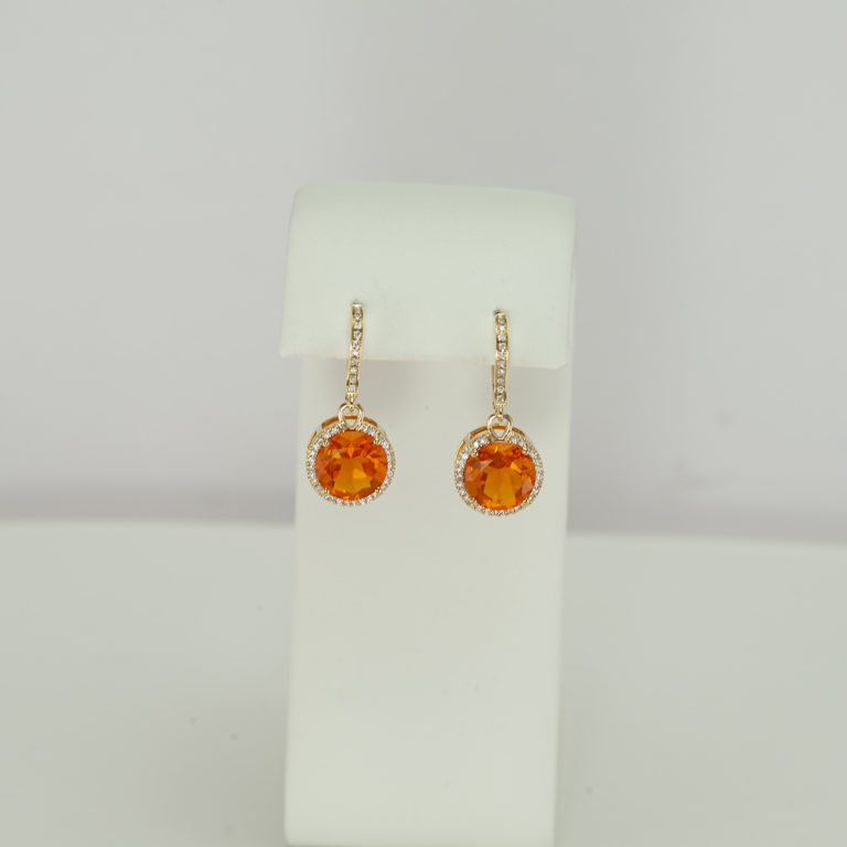 These are 14KT Yellow Gold Fire Opal Dangles with Diamond Halos. The lever backs are accented with diamonds as well. 