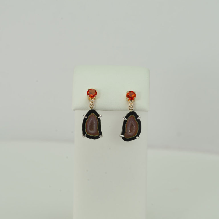 This pair of fire opal and geode earrings are one of a kind. The fire opal has been set in 14kt yellow gold and in silver