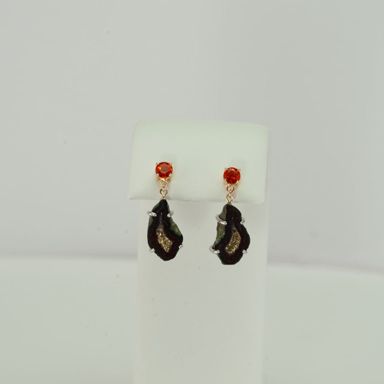 Here is a pair of geode and fire opal earrings. The fire opal has been set in 14kt yellow gold and the geodes have been set in silver.