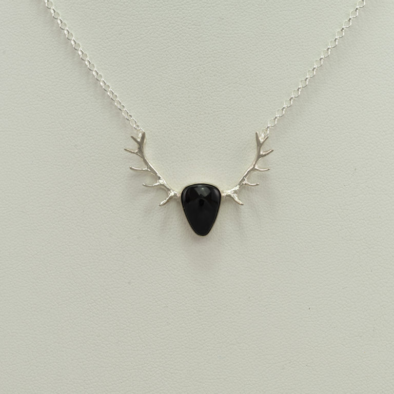 This is our Wyoming Black Jade Elk Antler Pendant in our small size. The antlers, chain and bezel are sterling silver.