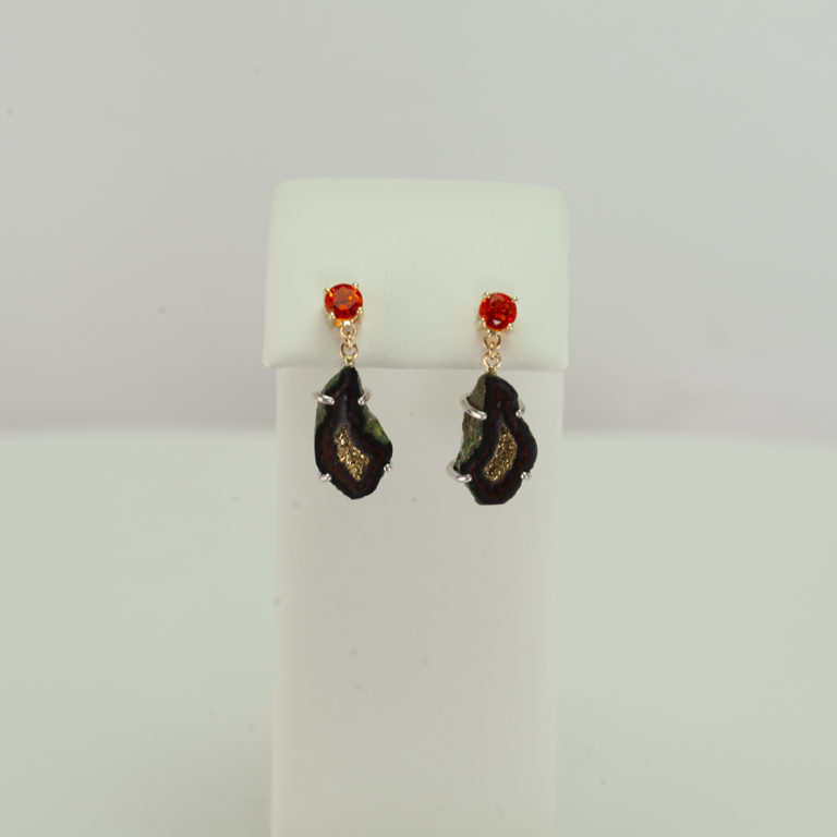 Gold geode earrings with fire opal accents. The geodes have been electroplated with gold and set in sterling silver. The posts and backs are 14kt gold.