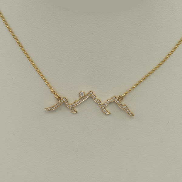 This is our diamond Teton line design. It has been cast in 14kt yellow gold and is encrusted with round, brilliant cut diamonds.