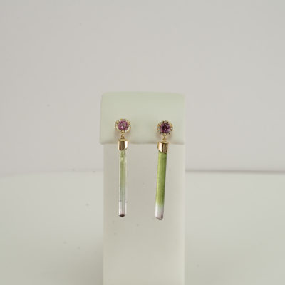 Here is a one of a kind pair of crystal earrings. The tourmaline crystals have been accented with Diamonds and pink tourmalines. The crystals and the diamonds have been set in 14kt yellow gold.