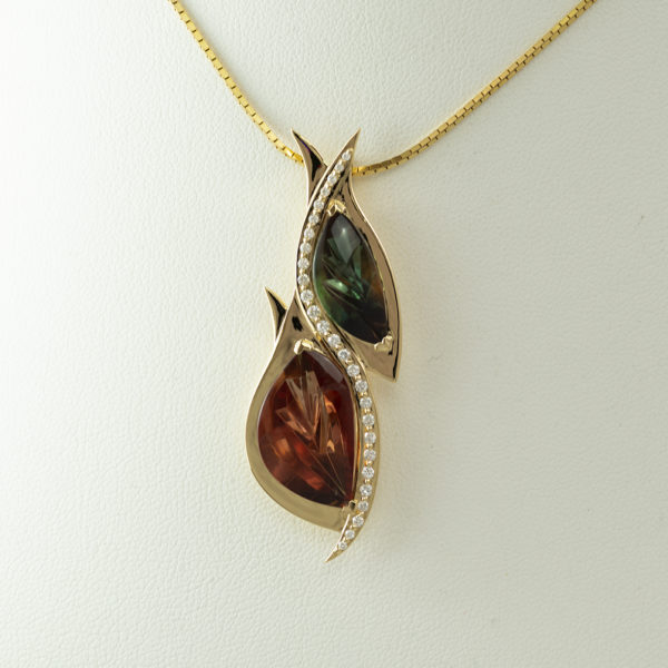Here is an Oregon Sunstone pendant. The sunstones have been cut be Alex Kreis and the design of the pendant by Dan Harrison. Accenting the sunstones are round, brilliant-cut diamonds. All the stones have been set in 18kt yellow gold.