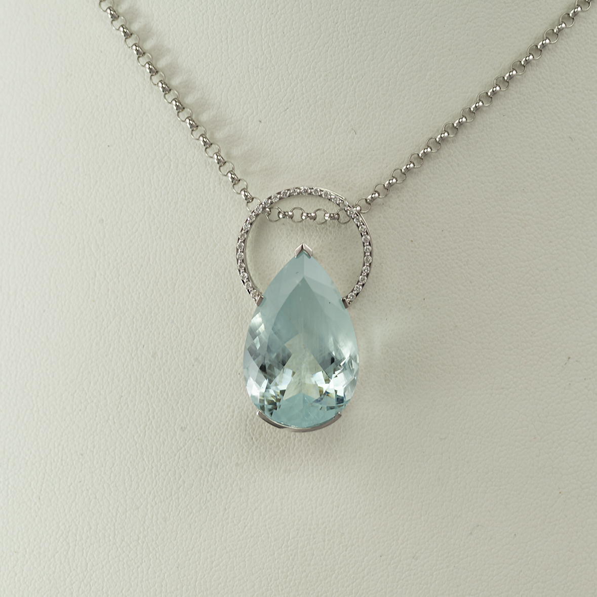 This pear cut aquamarine has diamond accents.