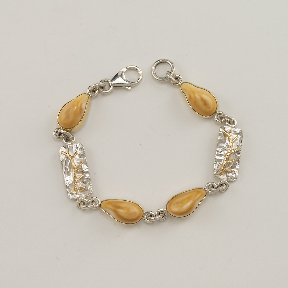 This antler and elk ivory bracelet is one of a kind.