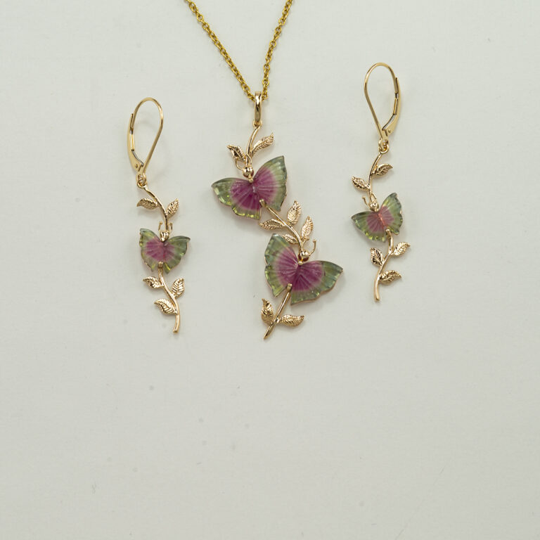 This butterfly jewelry set has been made with carved tourmaline wings and 14kt yellow gold. The earrings have been made with leverbacks. The pendant doesn't include the chain. These pieces are one-of-a-kind and can never be replicated. 