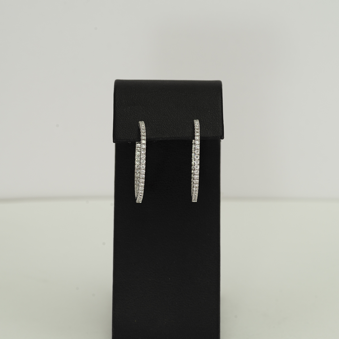 Here is a pair of in n' out diamond hoops set in 14kt white gold.
