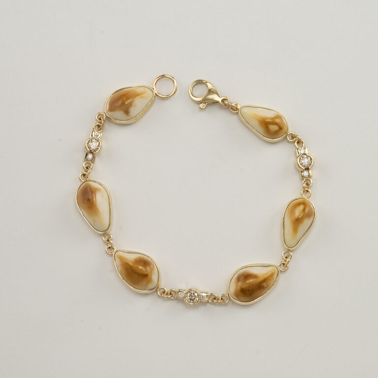 Here is an elk ivory and diamond bracelet. The diamonds are champagne in color. The elk ivories have been locally sourced. Shown in a size 8.