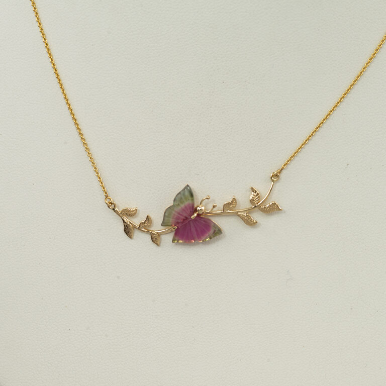 Here is a butterfly necklace. The butterfly is made from carved tourmaline. The gold is 14kt and the total length is 17.5". The petite rolo chain has a lobster claw clasp.