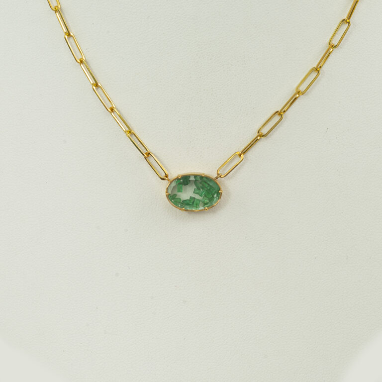 This Meira T emerald necklace was made with 14kt yellow gold. The chain is a paperclip necklace, which makes it adjustable in length. Lastly, Meira T has finished the piece with a lobster claw clasp.