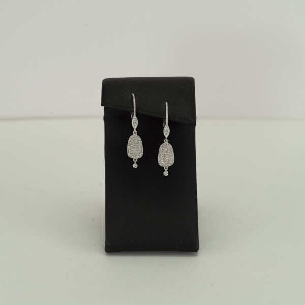 Here is a pair of oval Meira T Earrings. They were cast in 14kt white gold and have diamond accents. The diamonds are round, white diamonds.