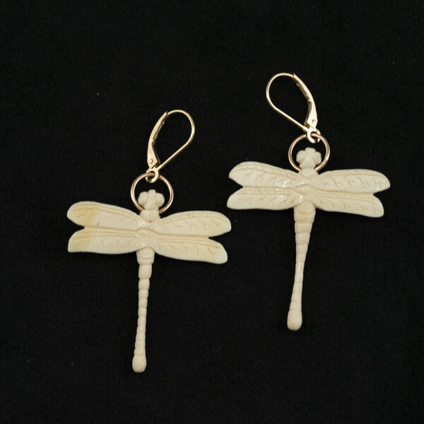 These dragonfly earrings were carved with mammoth ivory. The leverbacks are made with 14kt yellow gold. This pair of earrings are one-of-a-kind.