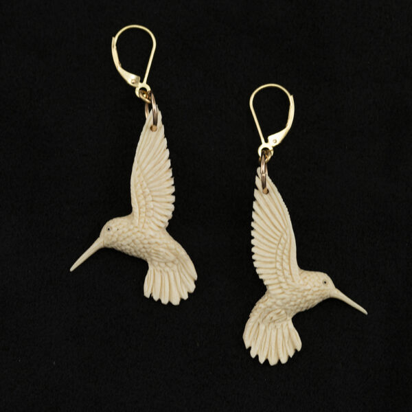 This hummingbird ivory earrings are one of a kind. The hummingbirds are fossilized mammoth ivory. The leverbacks are 14kt yellow gold.