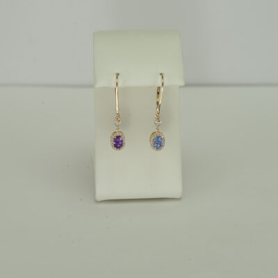 These sapphire earrings have diamond accents. Both the diamonds and the sapphires have been set in 14kt yellow gold. The have been made with leverbacks.