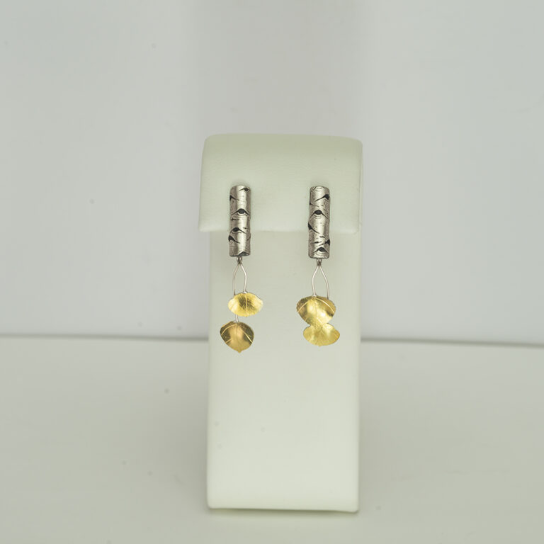 Here are aspen stud earrings with gold leaves. The leaves are bi-metal and the silver is argentium silver. Hand made in America.
