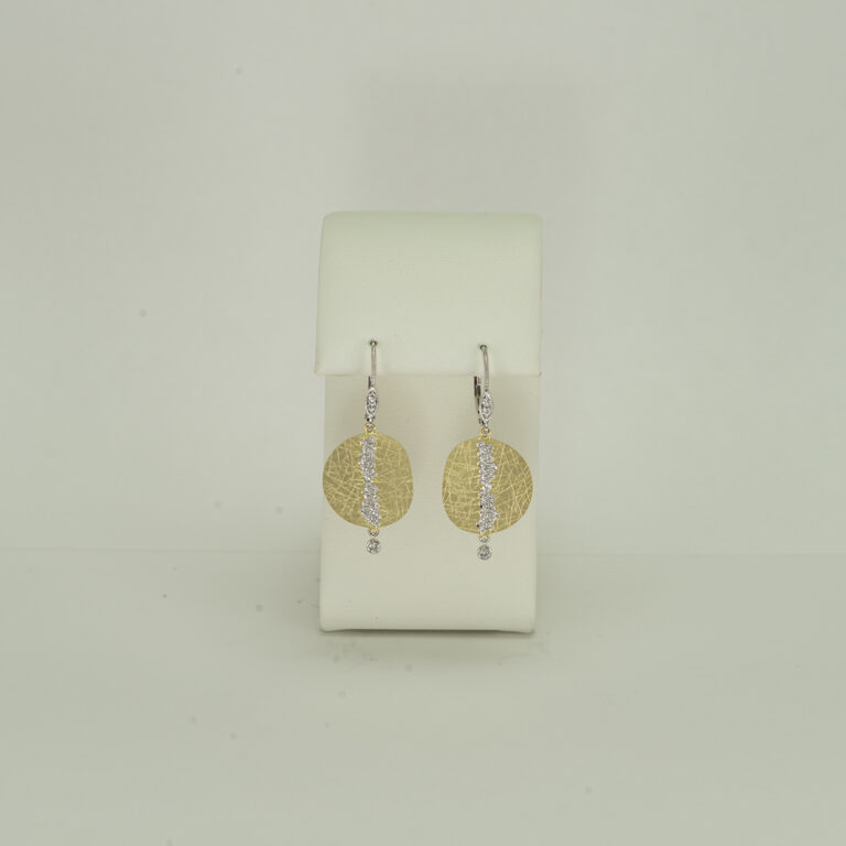 Here is a pair of two tone earrings by Meira T designs. They feature 14kt yellow gold, 14kt white gold and white diamonds. The diamonds are round, brilliant cut. 