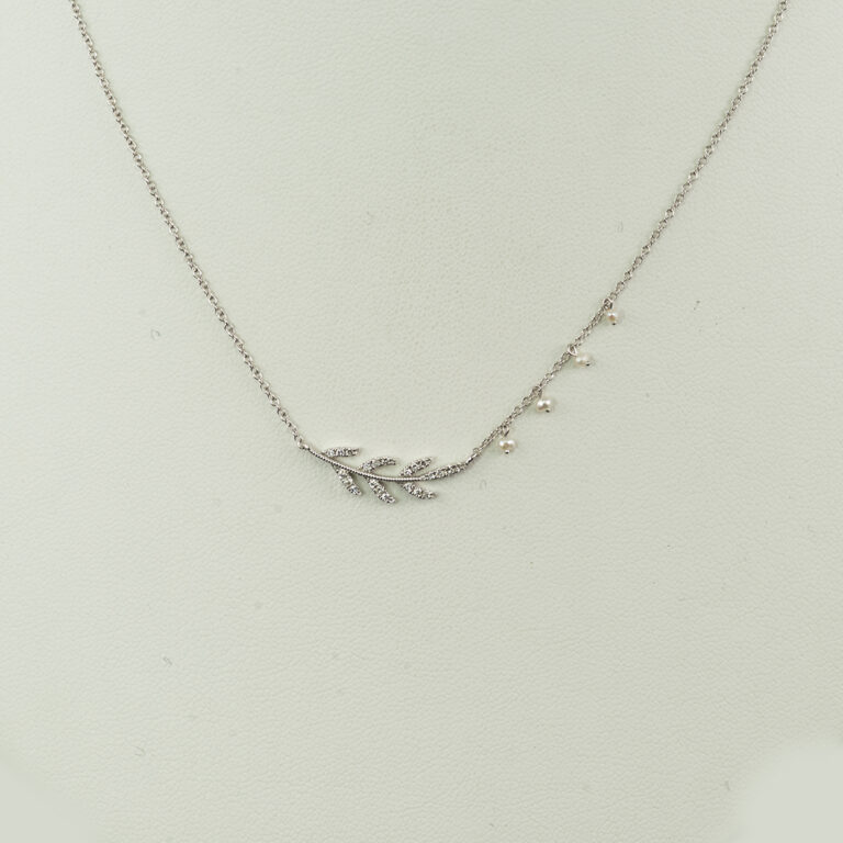 This laurel pendant was made with 14kt white gold. Set in the white gold are round cut diamonds. Designed and made by Meira T. The chain is adjustable.