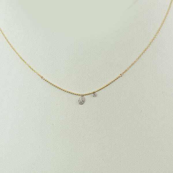 This dainty diamond necklace, by Meira T,  is created in 14kt yellow gold. It features .08ct diamonds, and an adjustable chain.