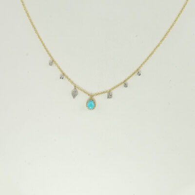 Here is a teardrop turquoise necklace by Meira T. It has 14kt white and yellow gold. Accenting the turquoise are diamond "charms". The chain length can be adjusted.