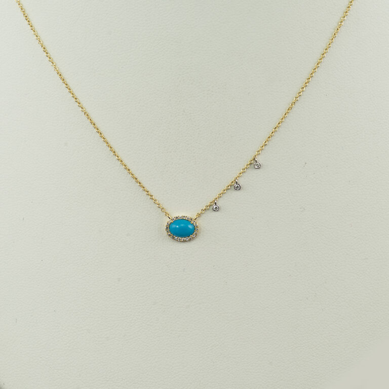 This is a two tone turquoise necklace. It has 14kt white and yellow gold. The oval cut turquoise has white diamond accents. The chain is adjustable in length.